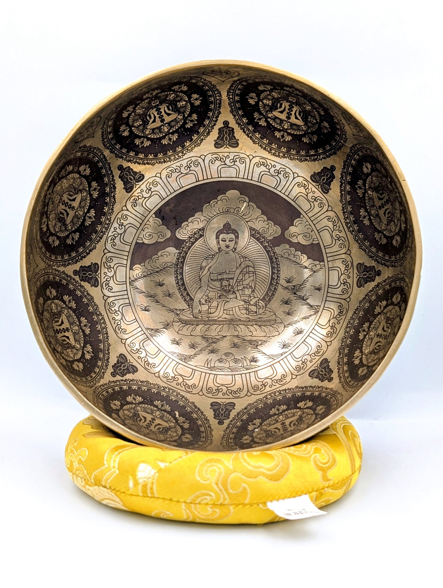 Decorative bowl with intricate designs on a white background
