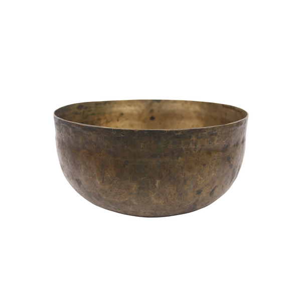 Bronze bowl with dimensions labeled on a beige background
