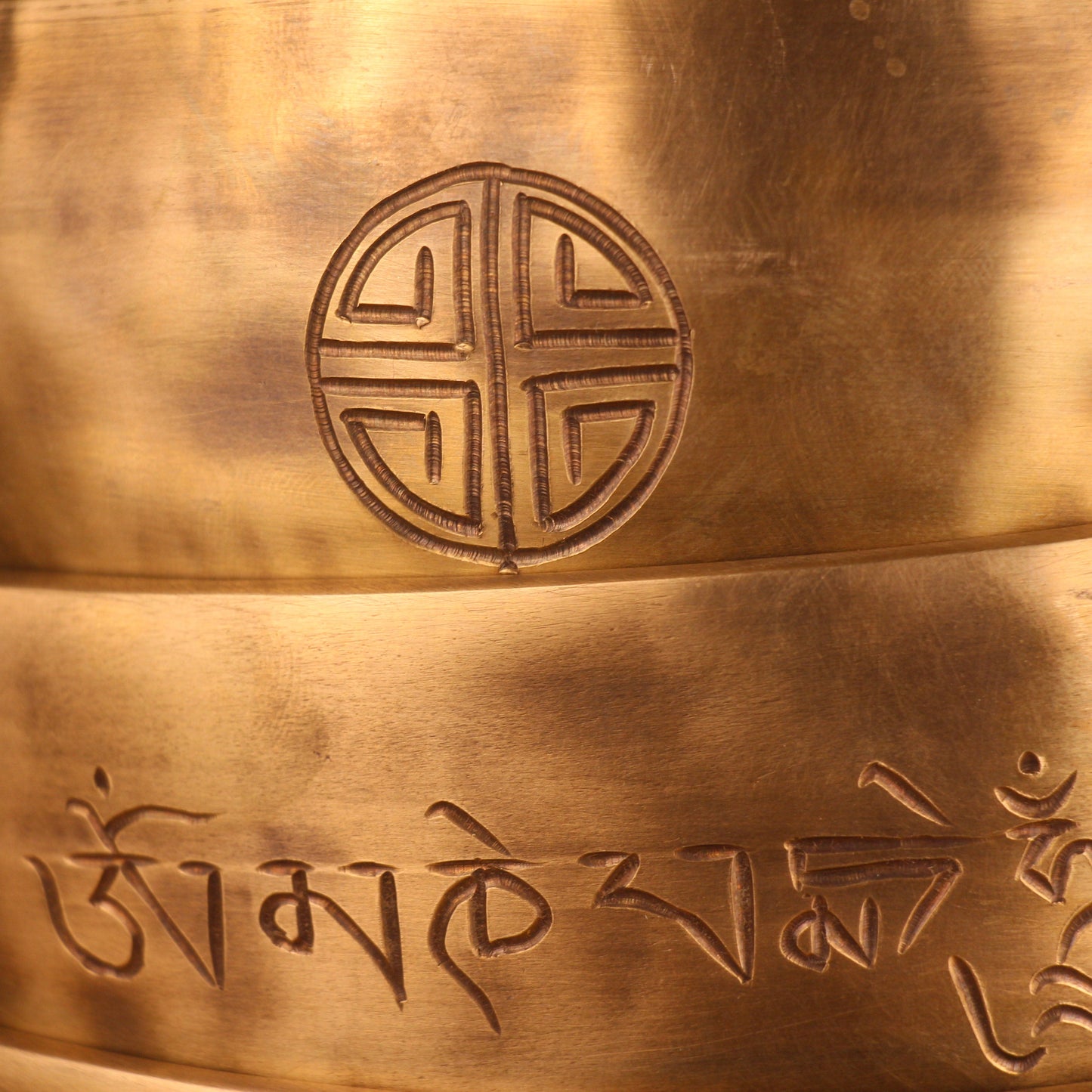 Bronze bell with engraved symbols and design