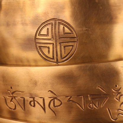 Bronze bell with engraved symbols and design