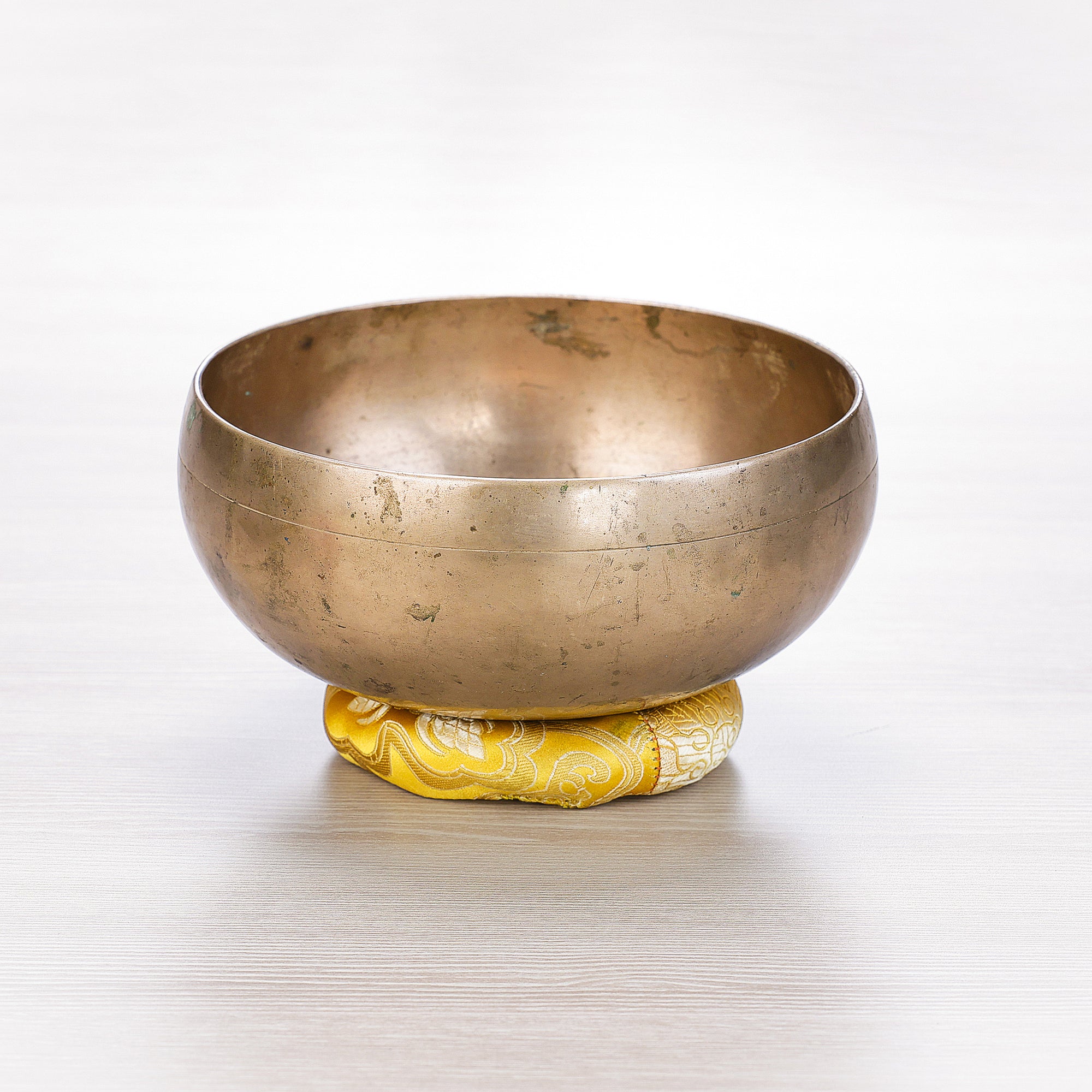 Antique Peter Hase singing bowl from Nepal with deep blackened patina and warm bronze finish