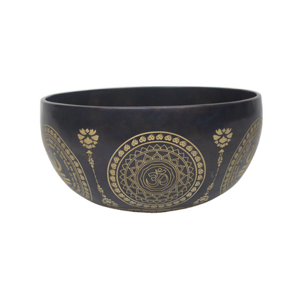 Black bowl with gold mandala design on a white background