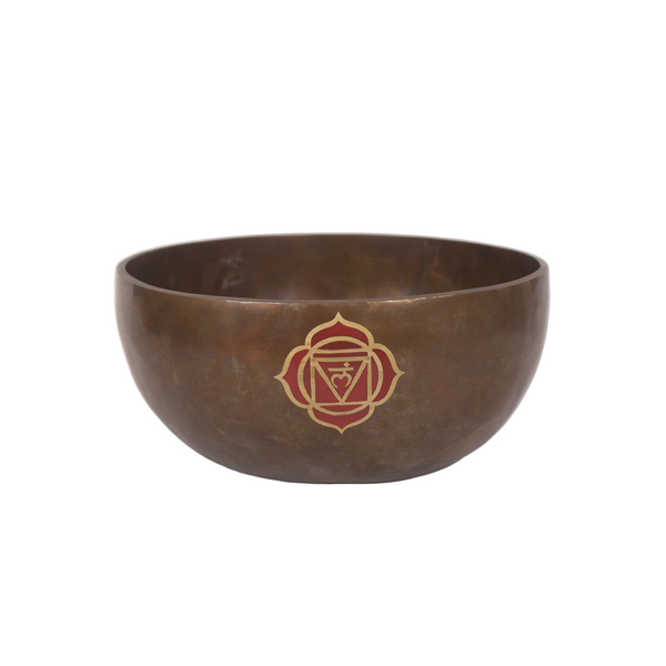 Bronze singing bowl with a red emblem on a white background