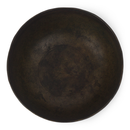 Dark brown ceramic plate on a white background