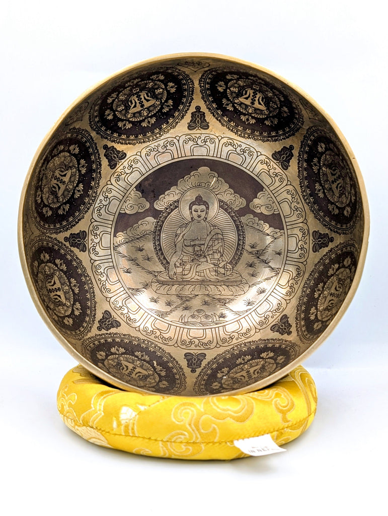 Decorative bowl with intricate designs on a white background