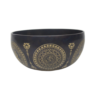 Black bowl with gold mandala patterns on a white background