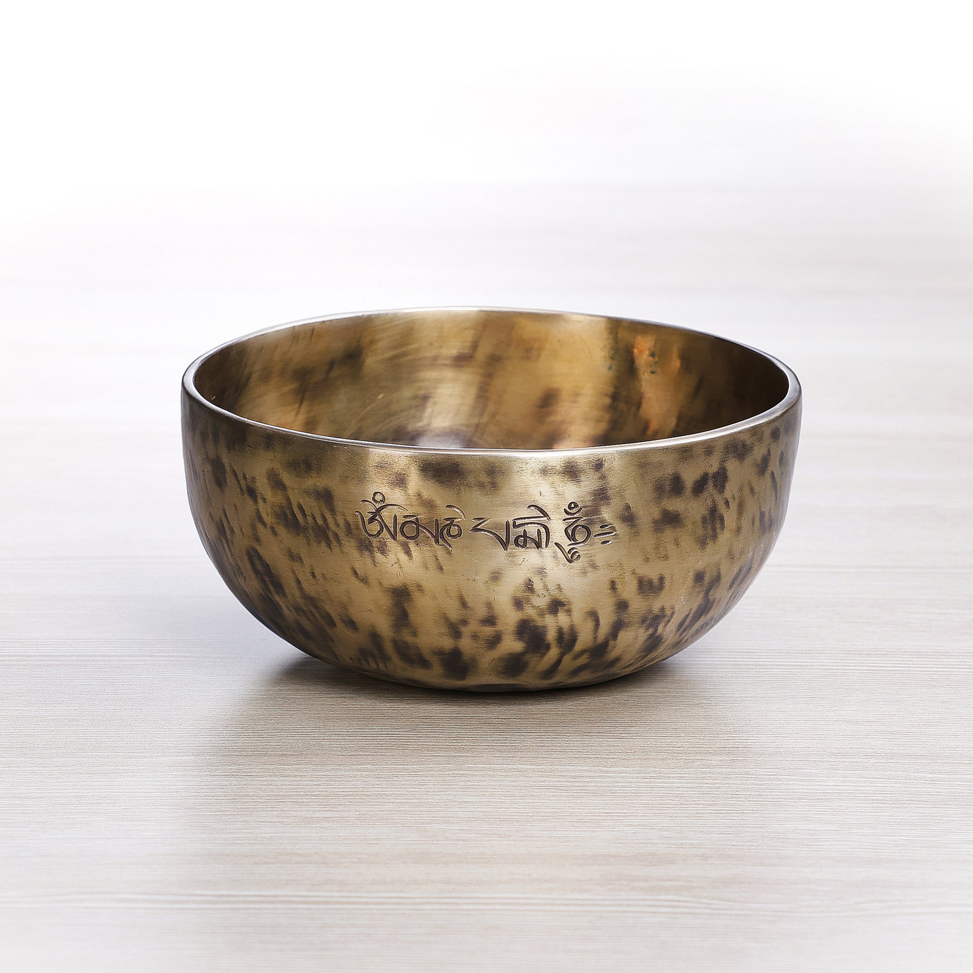 Light Tiger Full Moon singing bowl handcrafted in Nepal with Om Mani Padme Hum mantra engraving on outer rim