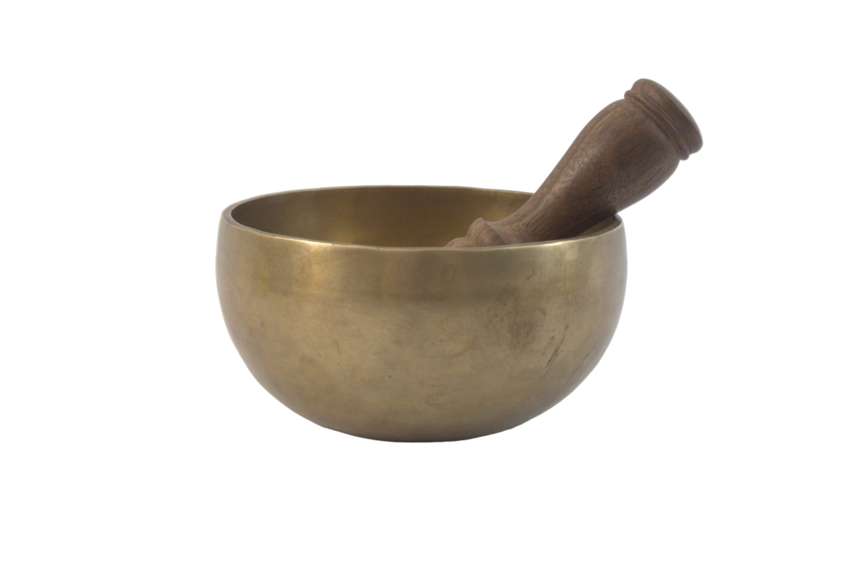 Brass singing bowl with a wooden striker on a white background