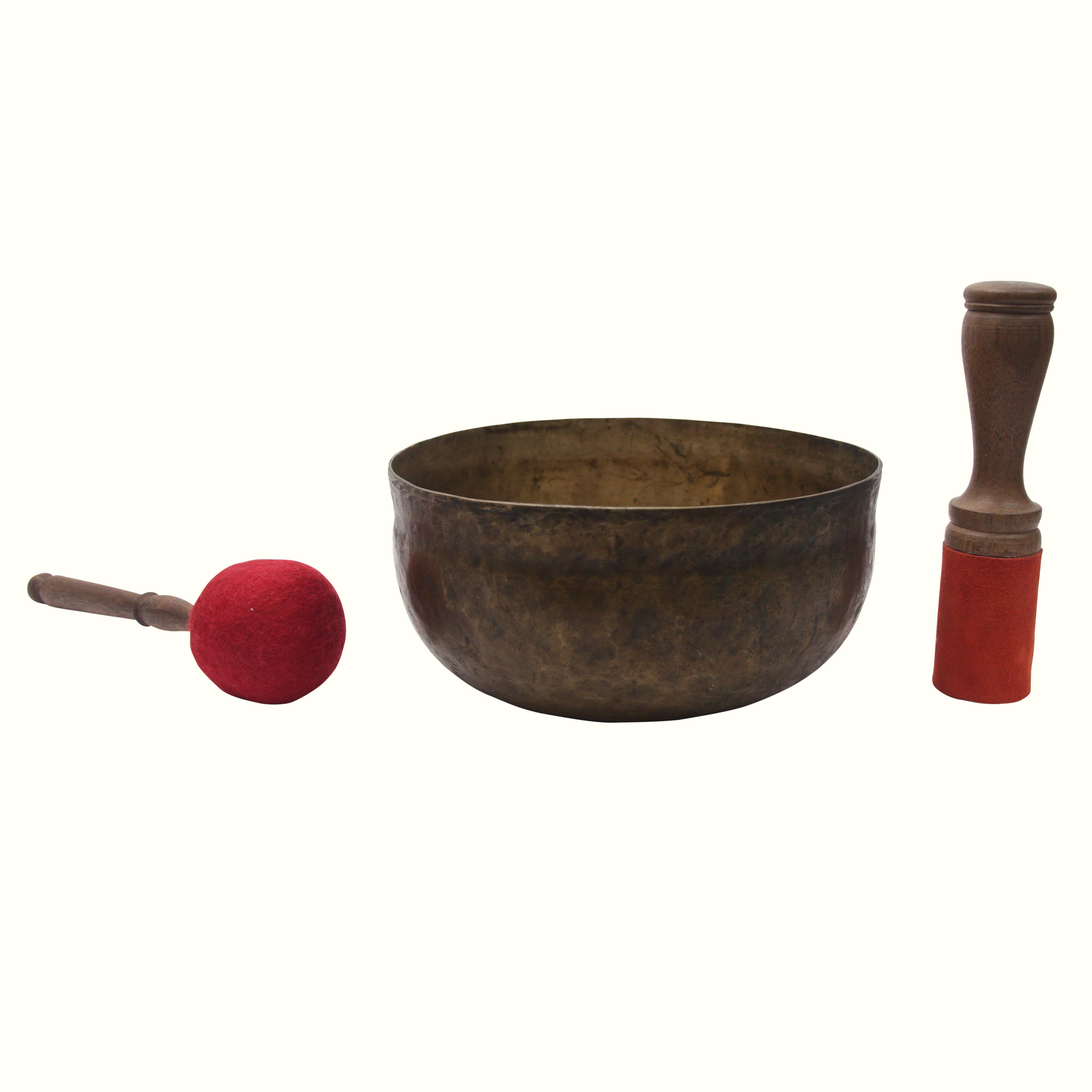 Tibetan singing bowl with two mallets on a white background