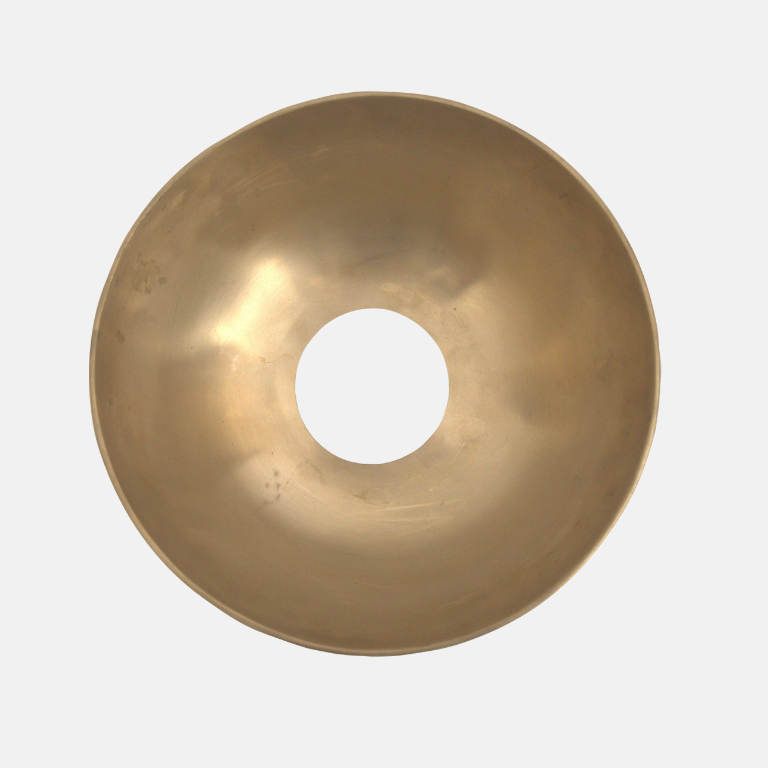 Gold bowl with a central hole on a white background