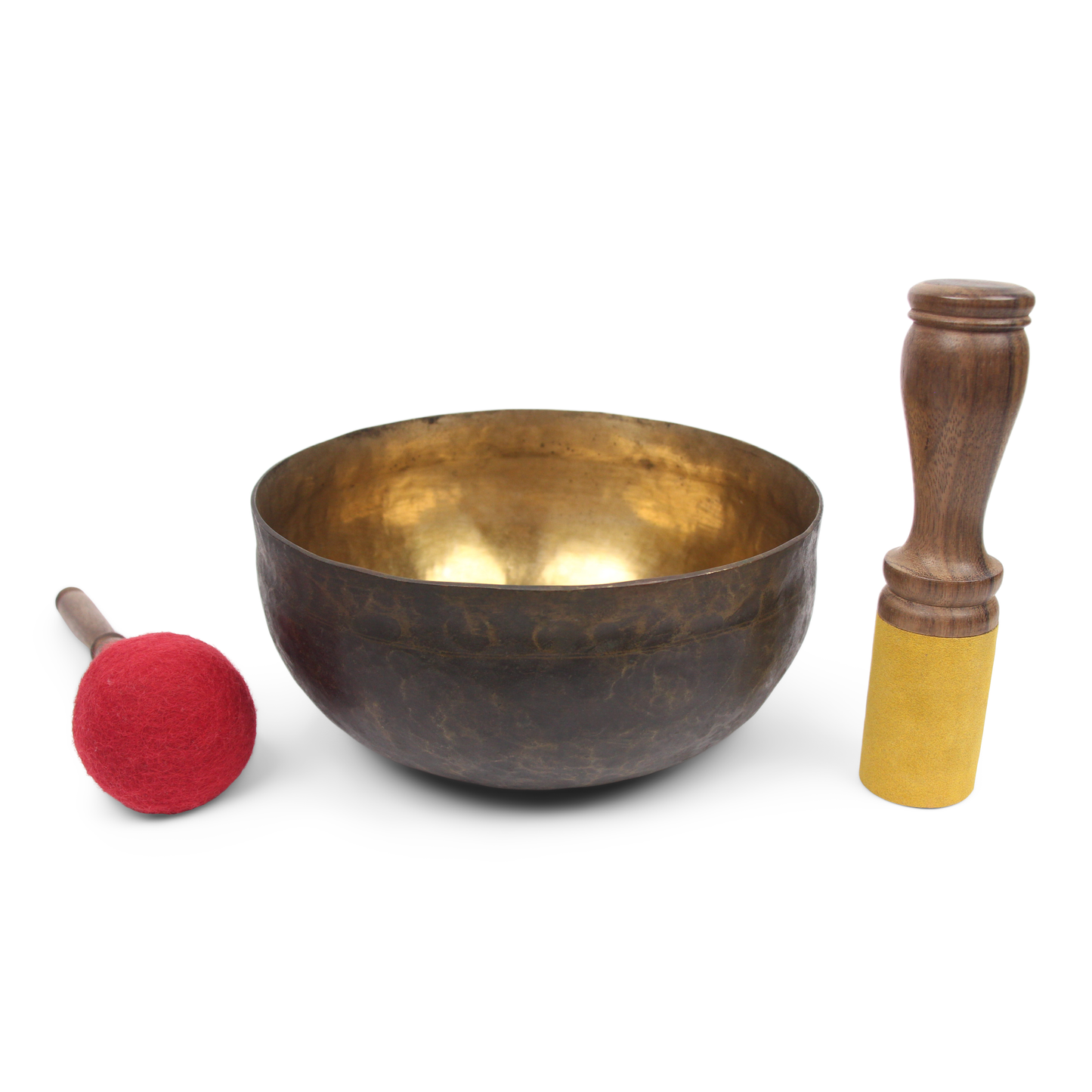 Bronze singing bowl with wooden handle and red mallet on a white background